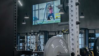 FITNESS2020 gyms are donned with displays of instructors leading workouts.