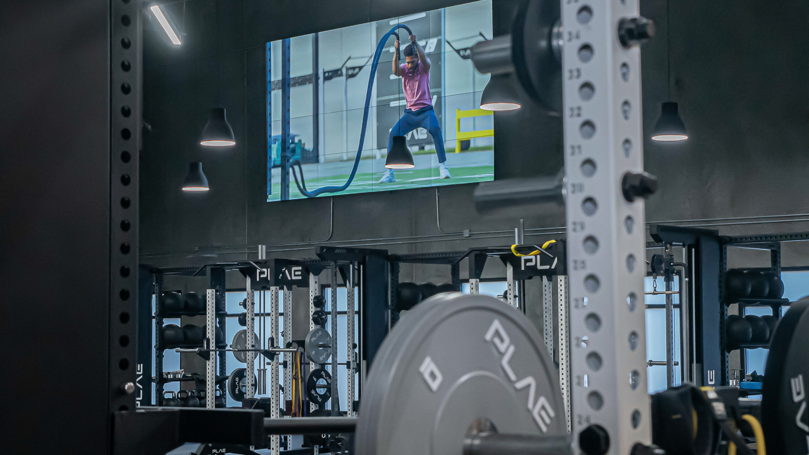 FITNESS2020 gyms are donned with displays of instructors leading workouts. 