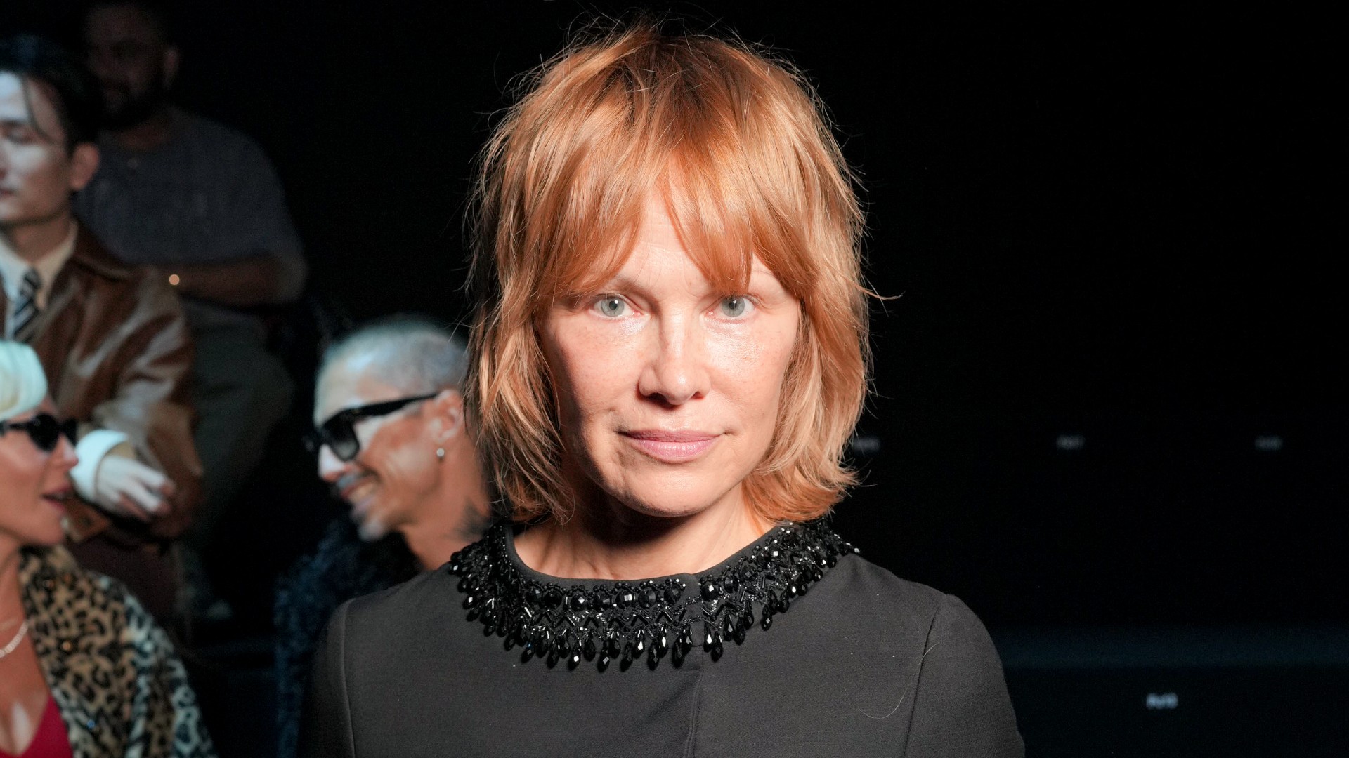 a white woman with short red hair