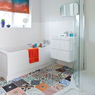 bathroom with patchwork tiles and basin