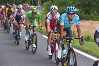 Andrey Zeits leading Tony Martin in the Tour de France peloton on stage 10