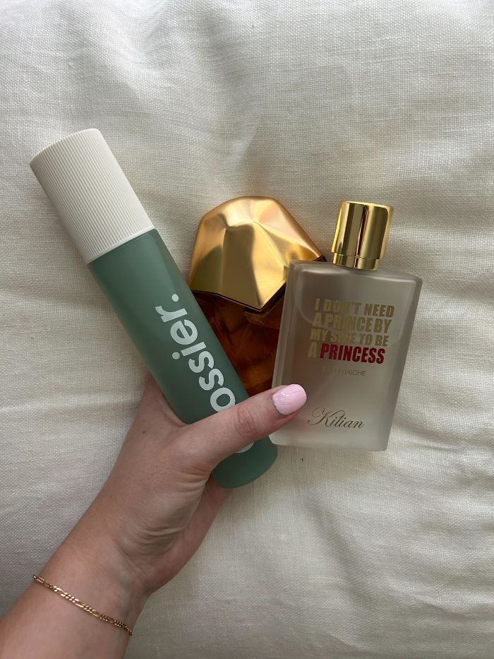 Junior beauty editor, Grace Lindsay, holding a Glossier, Kilian and Orebella perfume