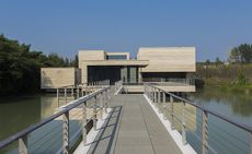 The Muxin Art Museum is a delicate lakeside addition