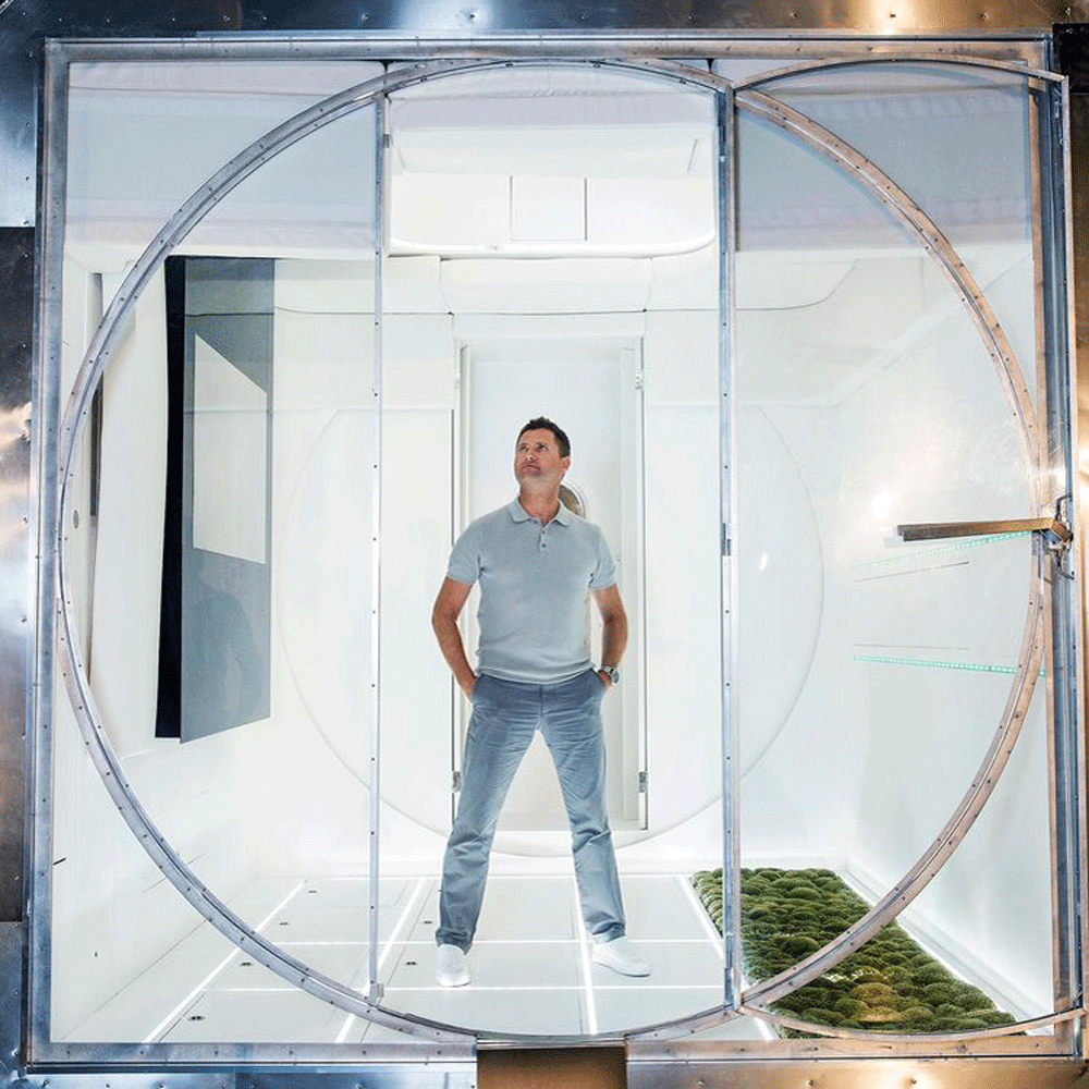 george clarke with glass door and white wall