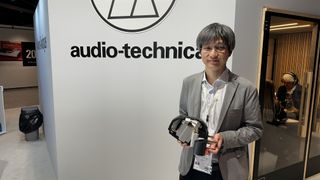 Yosuke Koizumi holding model of an AT-MCD1 cartridge