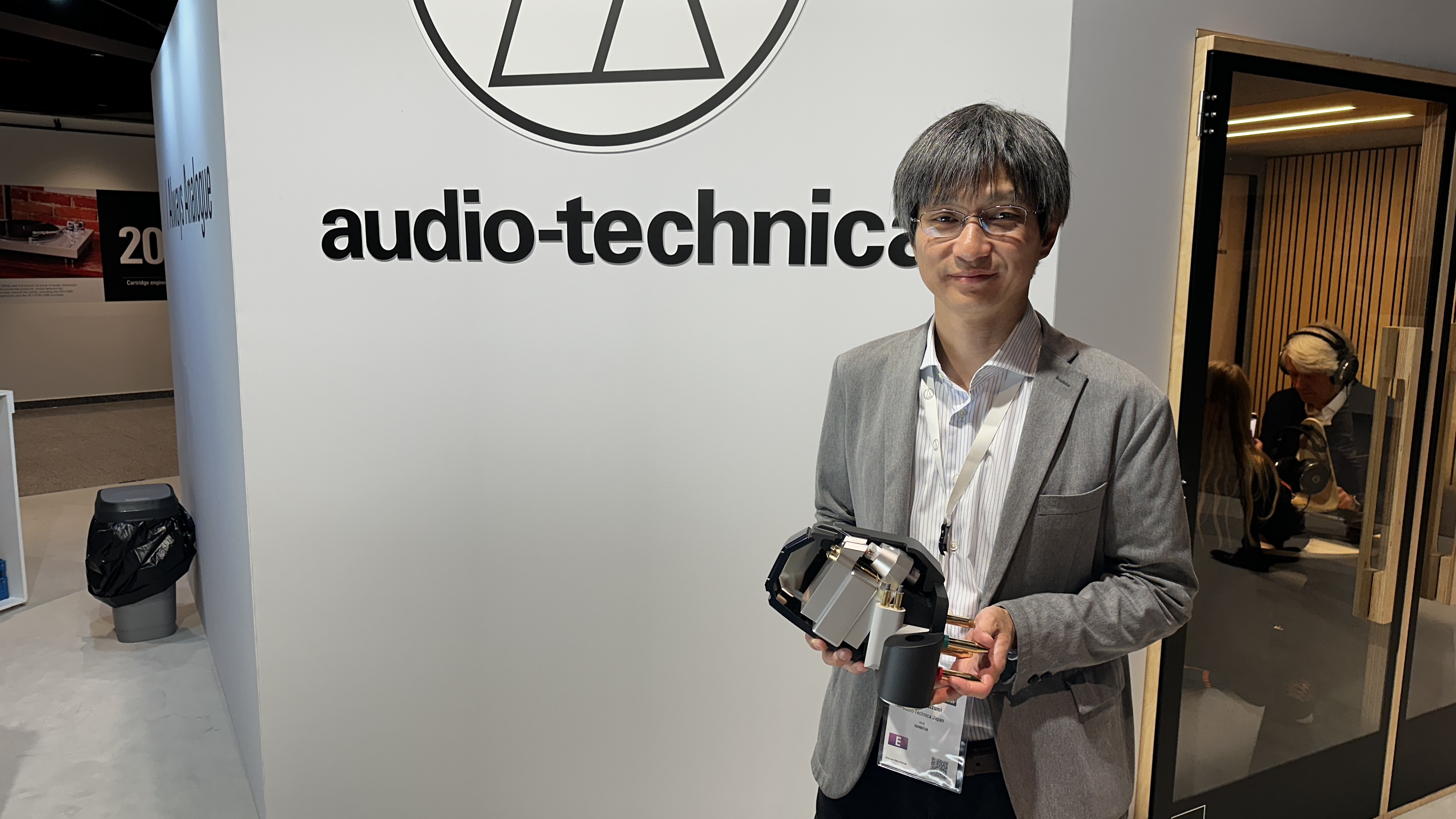 Yosuke Koizumi holding model of an AT-MCD1 cartridge