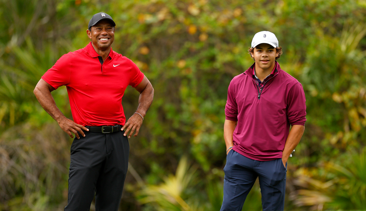 Tiger and Charlie Woods chat during the PNC Championship