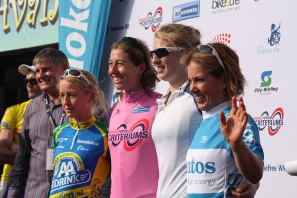 Emma Pooley (left) stands next to race leader in pink, Nicole Cook.
