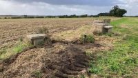 The top of a nuclear bunker in a field