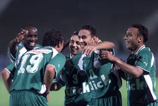 Egypt players celebrate a goal against Canada in April 2001.