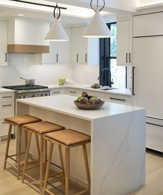 Contemporary white kitchen with kitchen island, wooden bar stools
