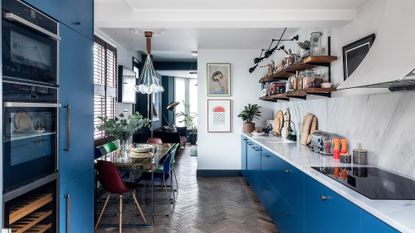 kitchen with wooden flooring and blue cabinets