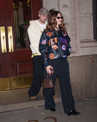 A photo of Hailey Bieber carrying The Row's Ingrid bag for a date at Madison Square Garden with Justin Bieber in New York City.