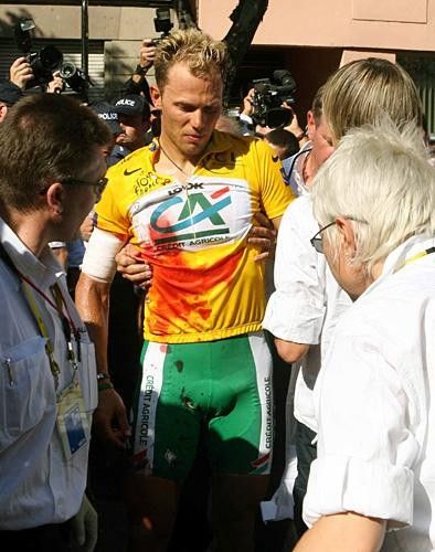 Thor Hushovd (CA) is helped away by the medical staff
