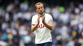 Tottenham striker Harry Kane applauds the fans after defeat to Brentford in May 2023.