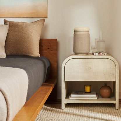 Blueair Mini Restful on a bedside table in a neutral, scandi-inspired bedroom