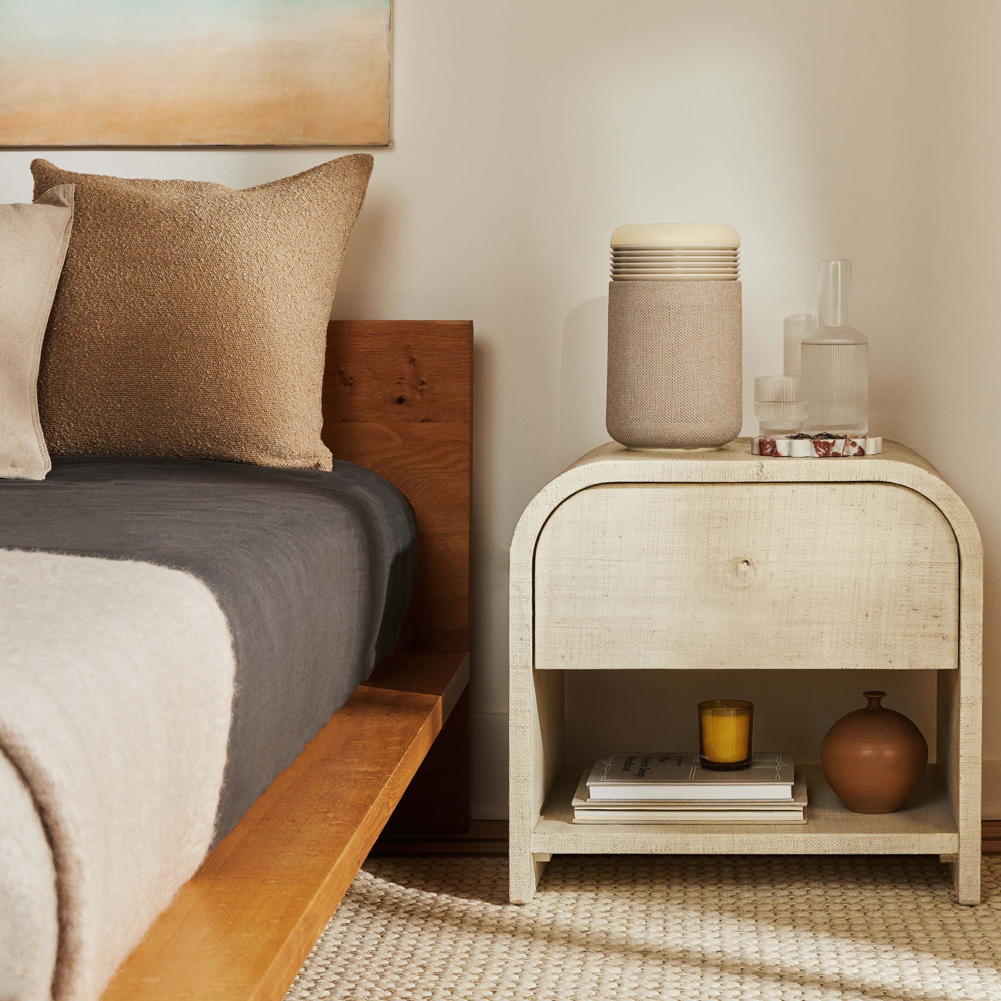 Blueair Mini Restful on a bedside table in a neutral, scandi-inspired bedroom