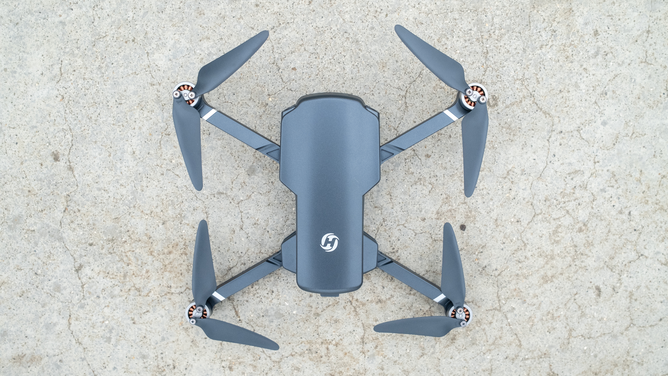 Holy Stone HS360S drone unfolded on concrete