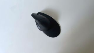 The HP 925 ergonomic vertical mouse seen from above on a white desk