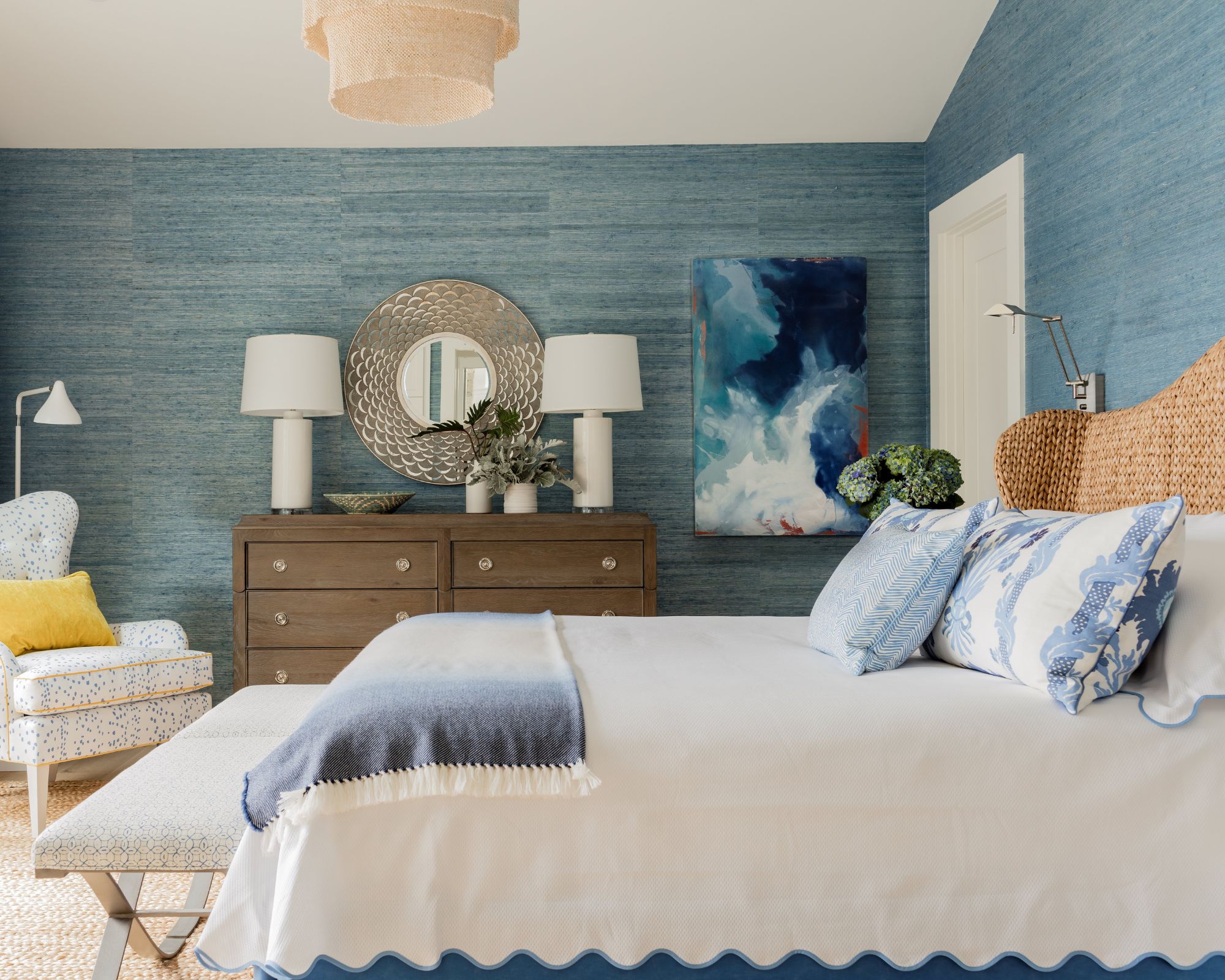 coastal bedroom with blue wall and white bedding