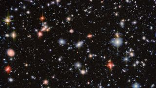 a deep field image showing many galaxies and stars