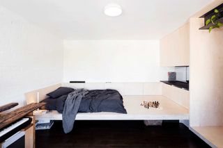 a microapartment with a platform bed