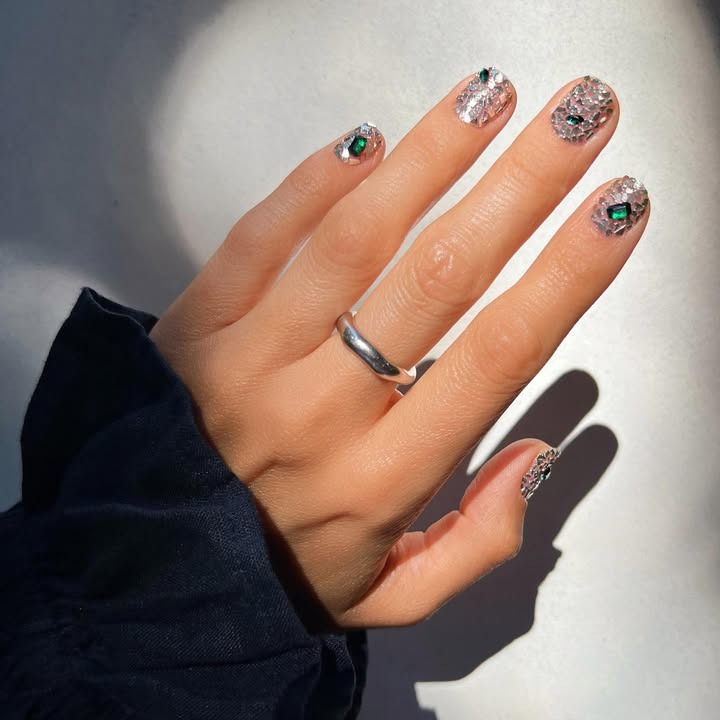 An image of jewel-encrusted nails.