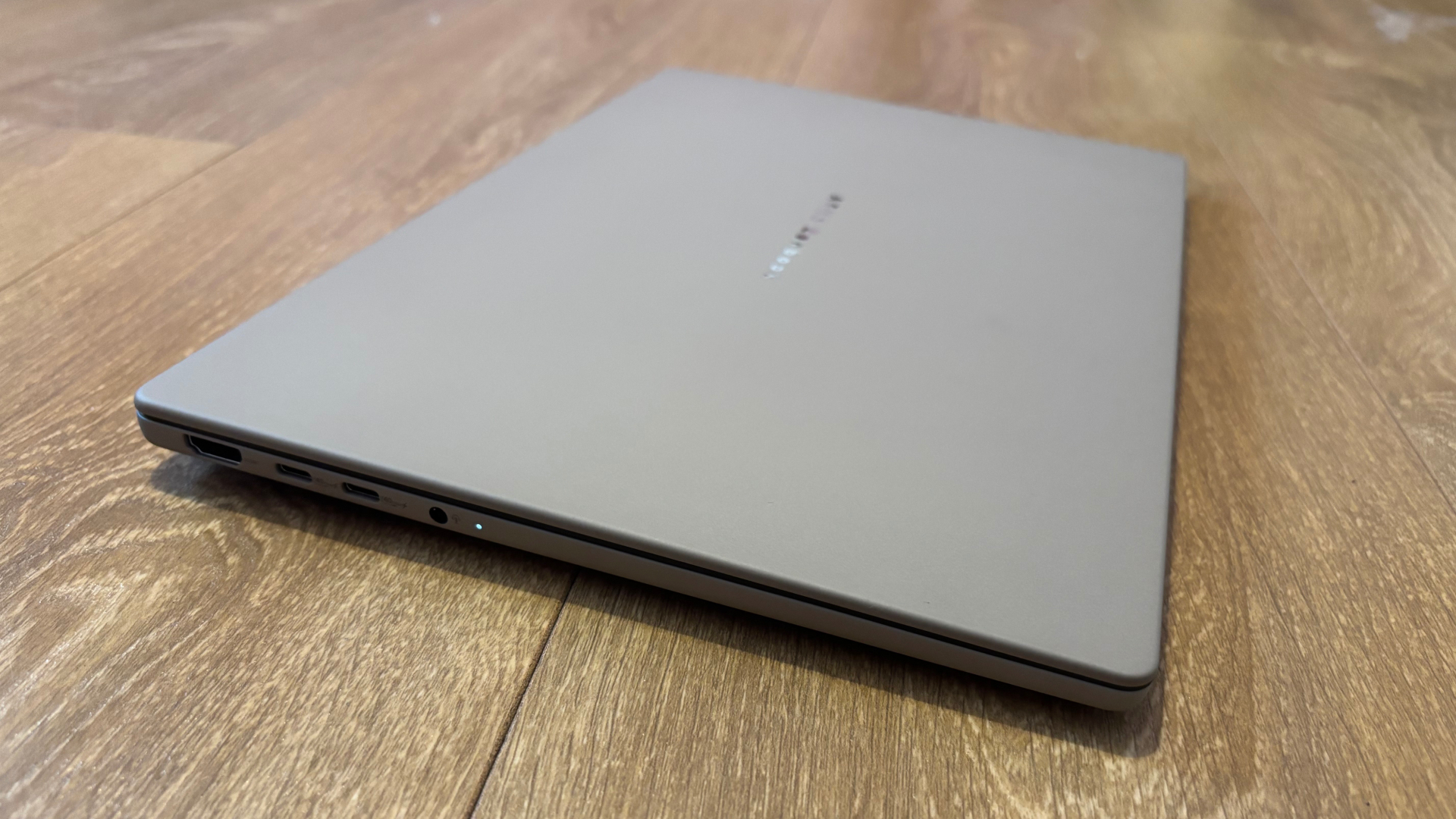 Asus Zenbook A14 laptop with its lid closed resting on the ground