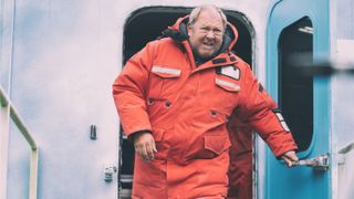 Coake (Mark Addy) exiting a building in Prime Video's "The Rig" season 2