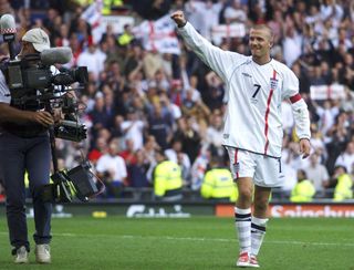 David Beckham celebrates after his iconic free-kick against Greece