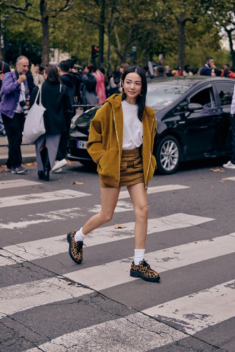 woman at fashion week wearing a loafer outfit