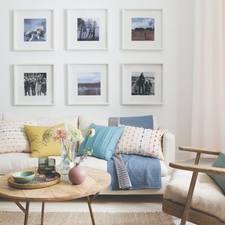 Mid-century modern living room with photos on the wall