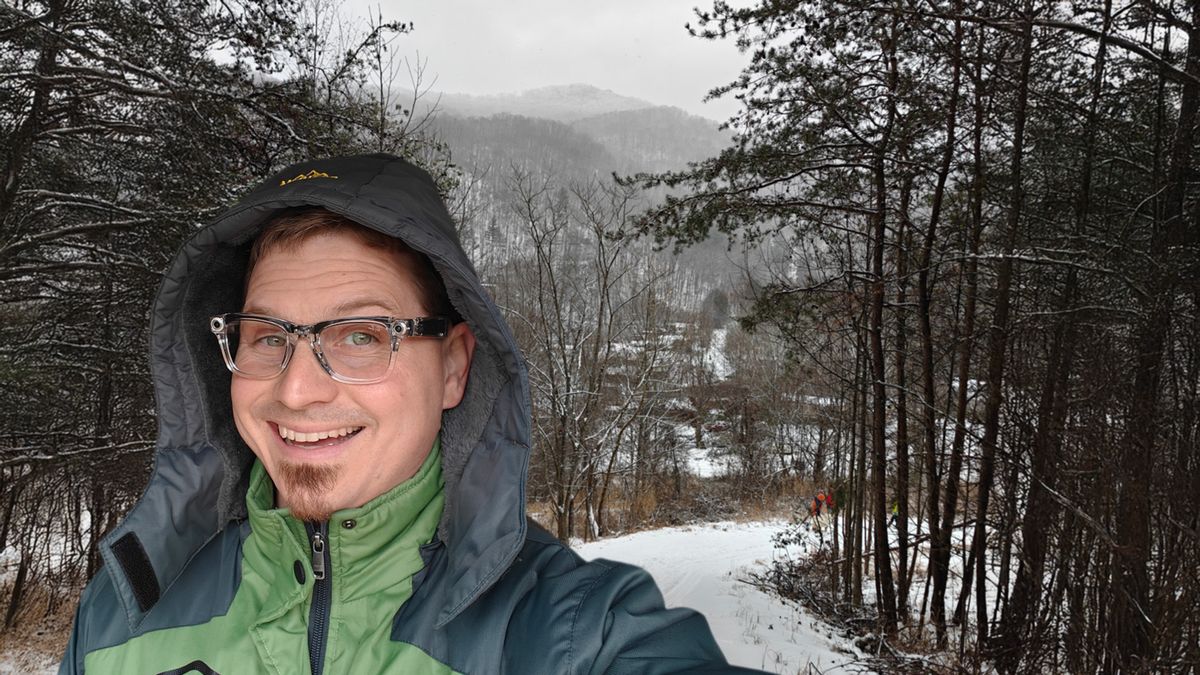 Wearing a pair of transparent Ray-Ban Meta Smart Glasses out in the snow