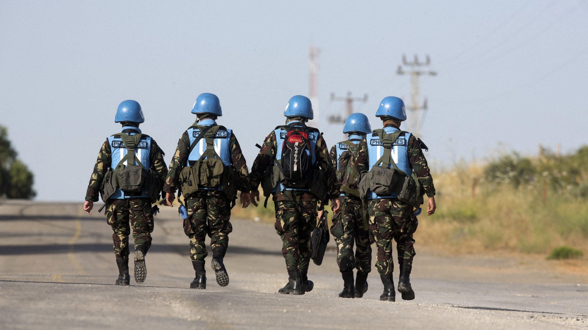 United Nations peacekeepers cross an Israeli army checkpoint in the annexed Golan Heights