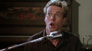 Dennis Quaid singing into a old fashioned microphone in Great Balls Of Fire!