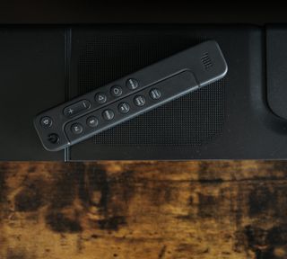 JBL Bar 800 remote resting on top of soundbar