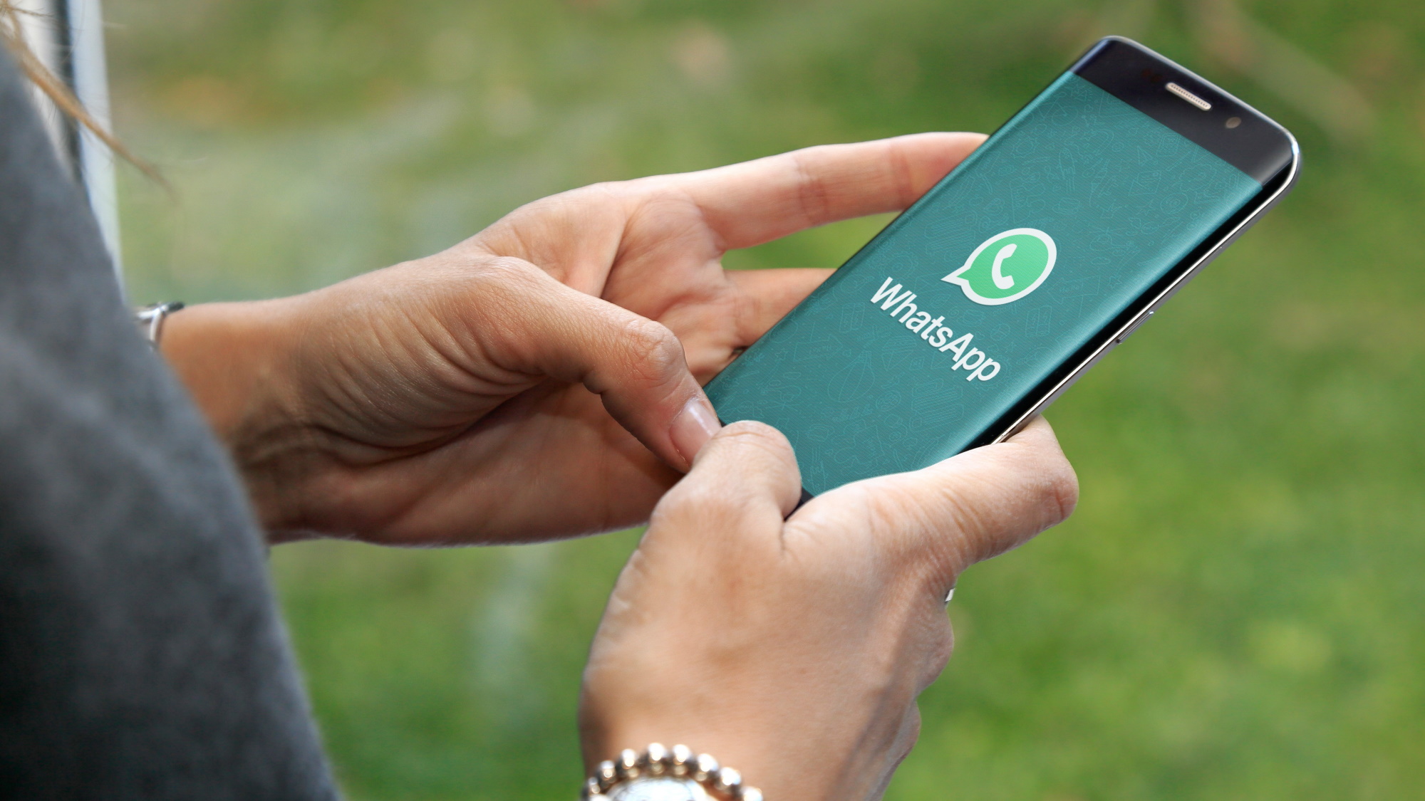 WhatsApp logo shown on a smartphone