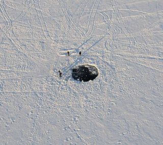 Impact site of the main mass of the Chelyabinsk meteorite formed an 8-metre-wide hole in the ice of Lake Chebarkul, 70km west of Chelyabinsk.