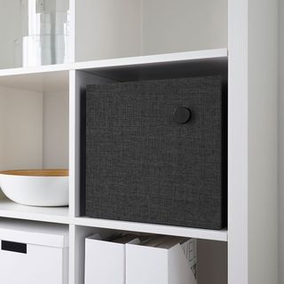white shelves with black bluetooth speaker