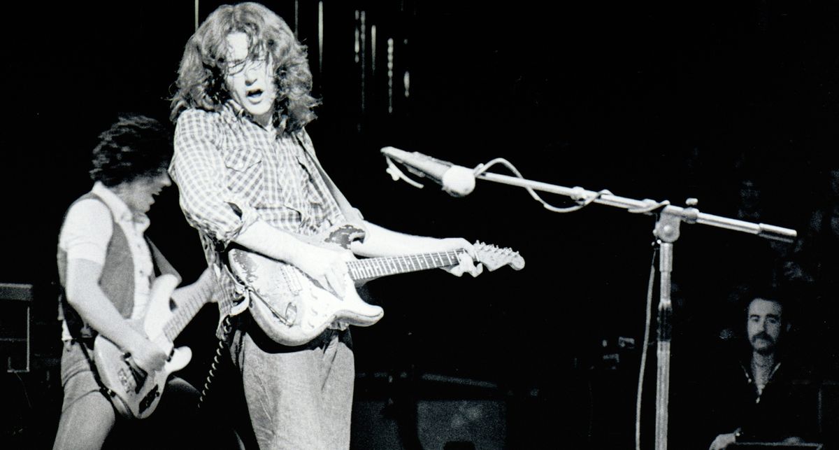 A black-and-white image of Rory Gallagher playing his &#039;61 Strat at the Royal Albert Hall