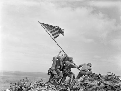 Marines raise a U.S. flag in Iwo Jima during World War II.
