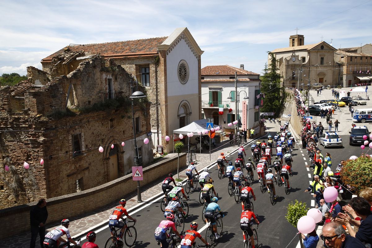 The peloton pass through a town on stage 7