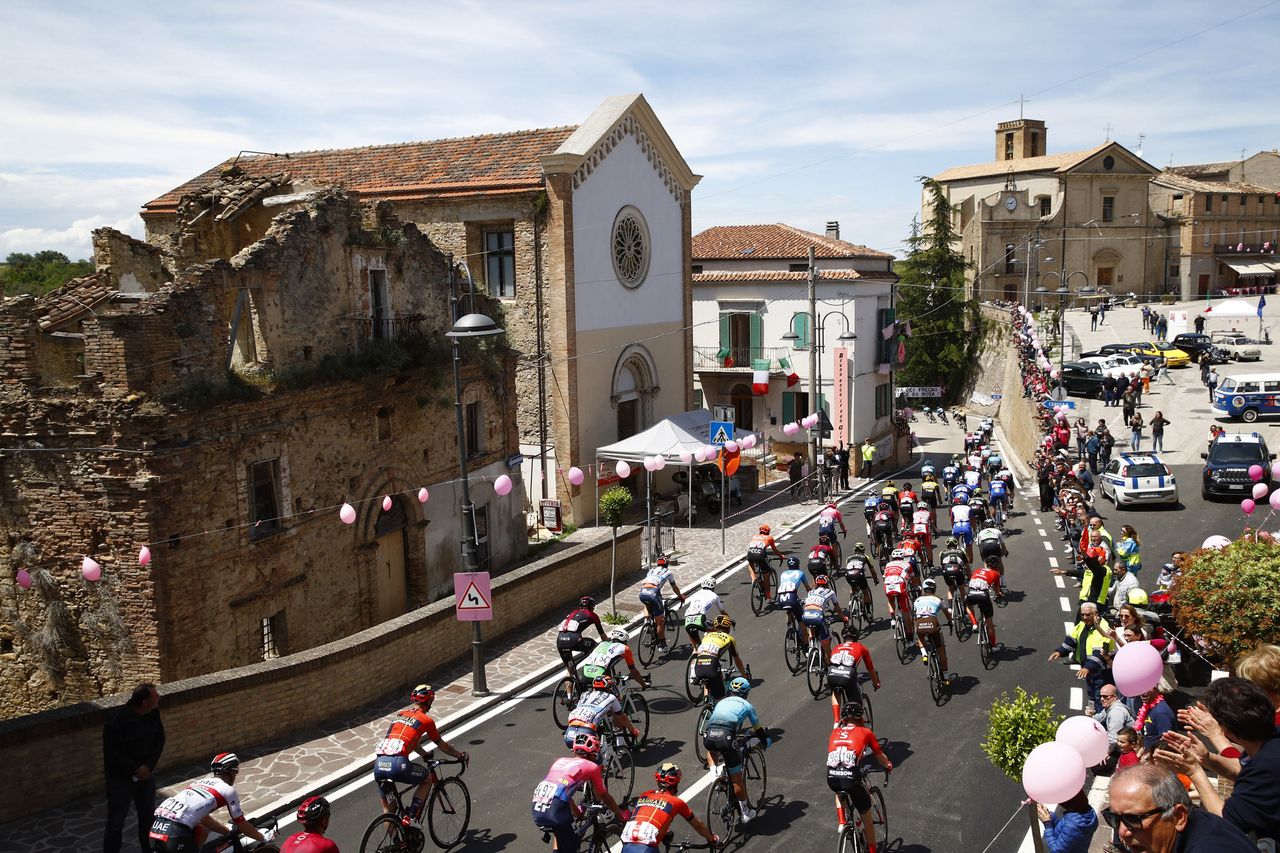 The peloton pass through a town on stage 7
