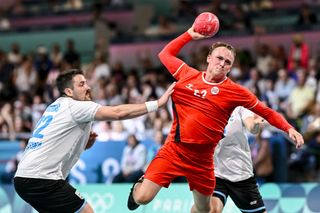 Gaston Mourino of Argentina and Tobias Grondahl of Norway battle for the ball during the men's Handball Preliminary Round - Group B match between Norway and Argentina on Day 1 of the Olympic Games Paris 2024 at South Paris Arena 6 on July 27, 2024 in Paris, France.