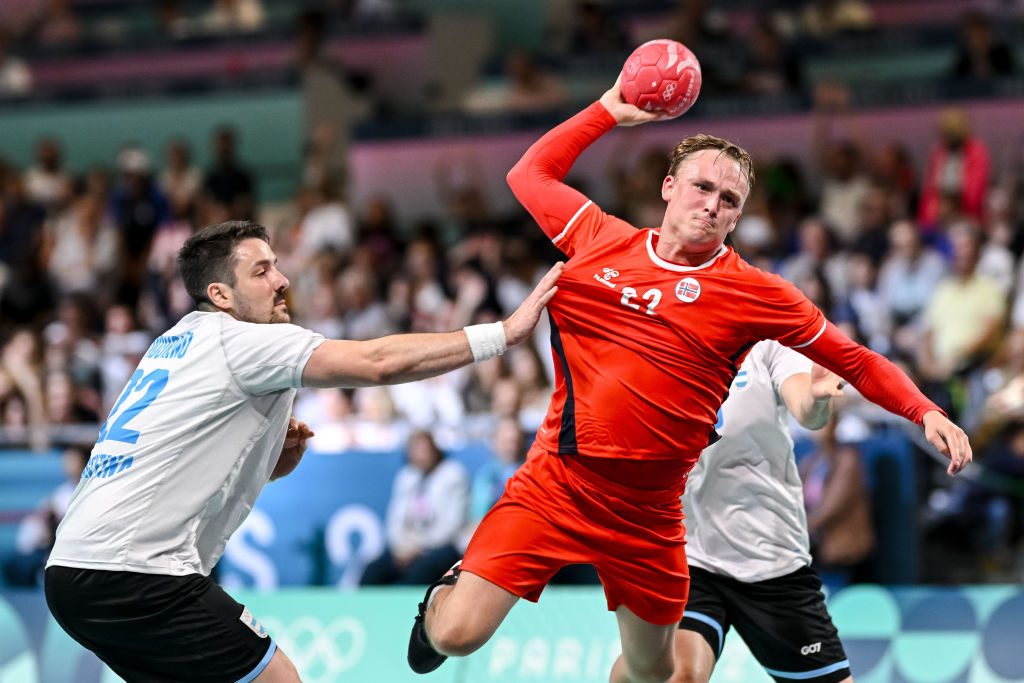 Gaston Mourino of Argentina and Tobias Grondahl of Norway battle for the ball during the men's Handball Preliminary Round - Group B match between Norway and Argentina on Day 1 of the Olympic Games Paris 2024 at South Paris Arena 6 on July 27, 2024 in Paris, France.