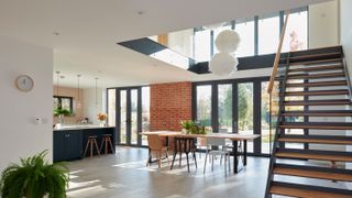 open plan kitchen dining room with double height ceiling