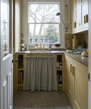 rustic sink with curtain in pantry