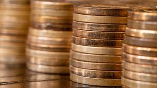 Banner with piles of coins on the table. Coins side view. Coins macro shot.