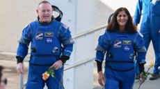 NASA’s Boeing Crew Flight Test Commander Butch Wilmore (L) and Pilot Suni Williams walk out of the Operations and Checkout Building on June 05, 2024 in Cape Canaveral, Florida