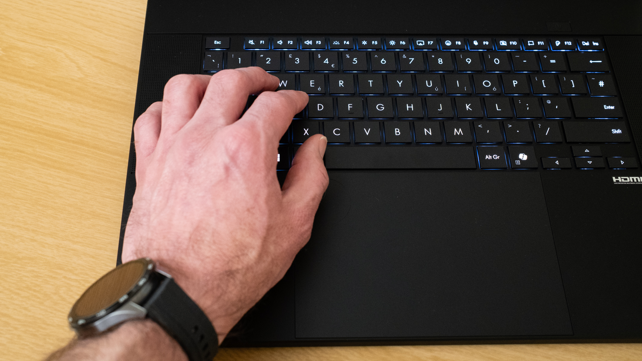 Hand typing on the Asus ProArt P16 2025
